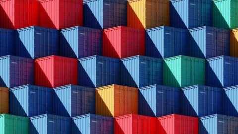 Colorful stacked shipping containers representing diverse supplier relations.